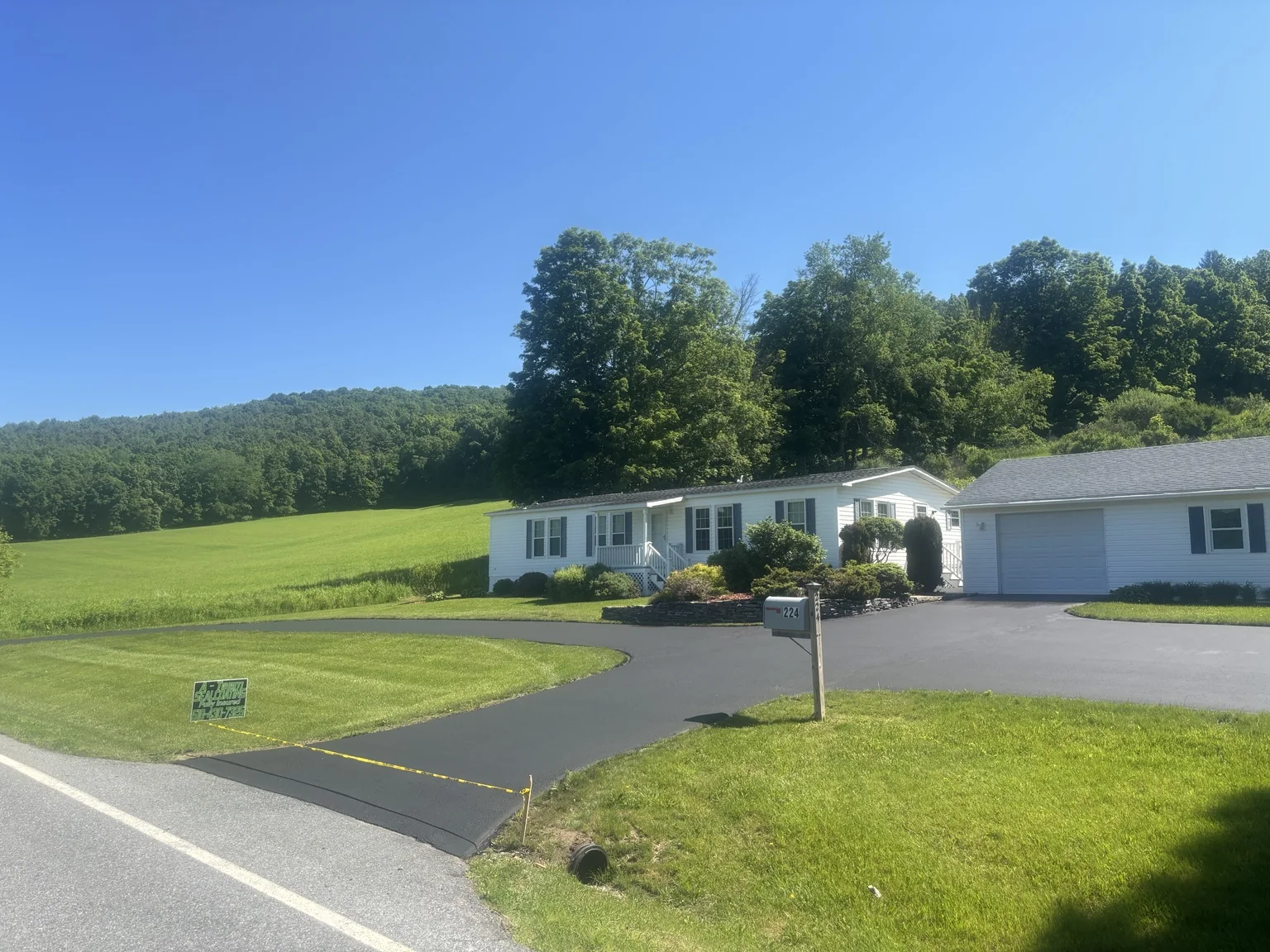 Freshly sealed country driveway
