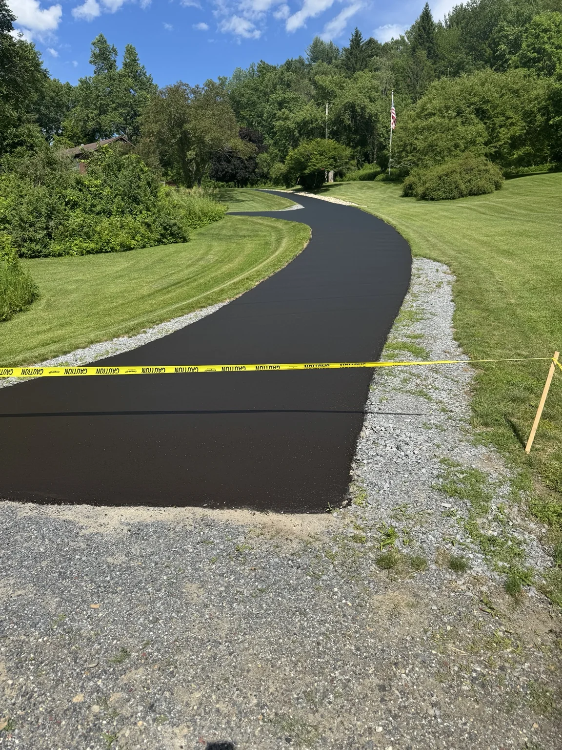 Long winding driveway after sealcoating